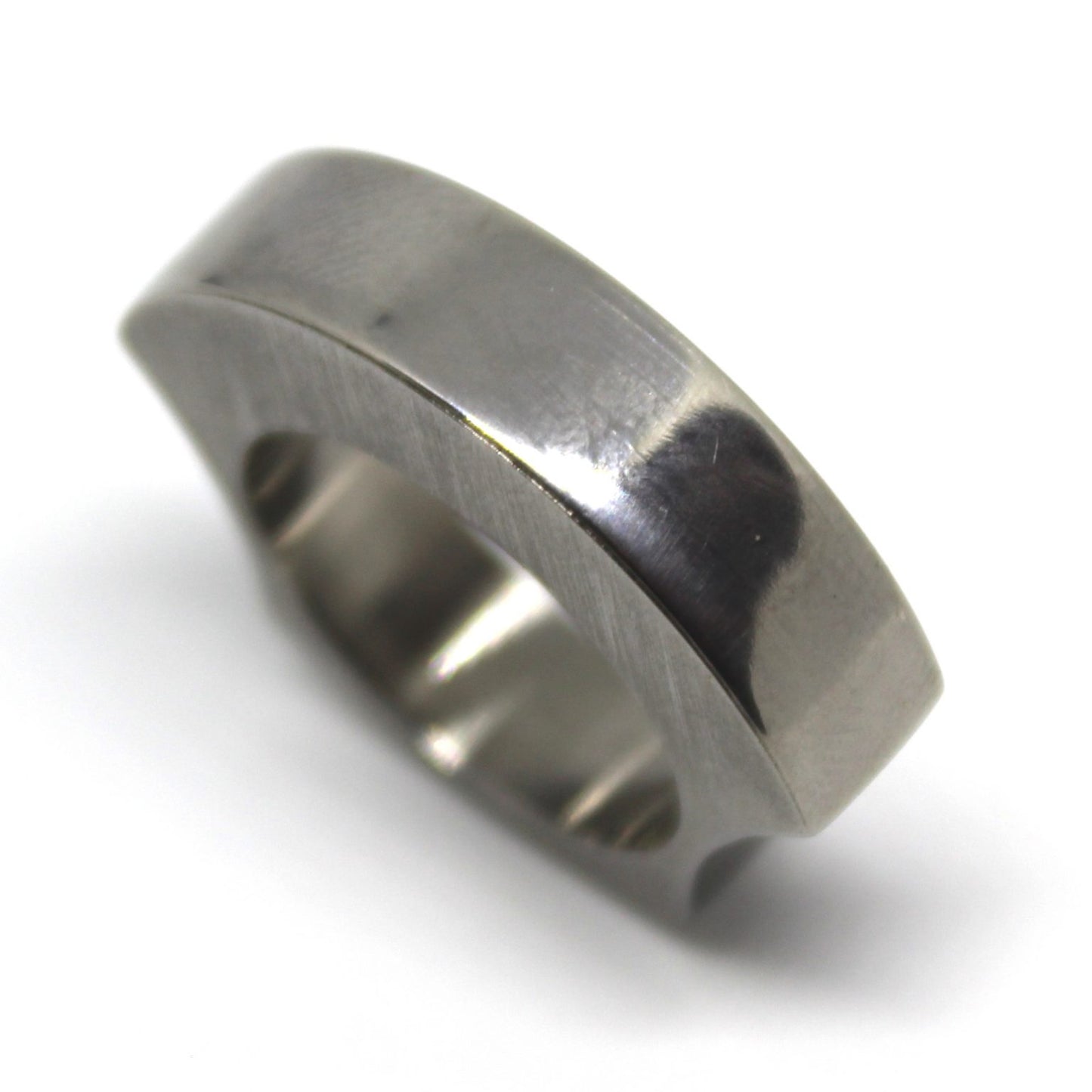 Solid titanium ring ergonomically designed for comfort, featuring a chunky appearance without bulk. Ideal for everyday wear, combining style and functionality for modern jewelry lovers.